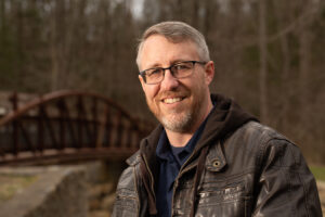 An image of Fred Jacoby is captured. Fred is a Christian counselor, author and director of Foundations Christian Counselling Services. Fred is featured on the Faith in Practice Podcast, a therapist podcast.