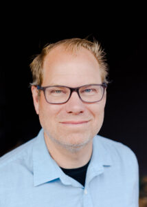 A photo of Greg Higdon is captured. Greg Higdon is the Founder of Grow the Books, a bookkeeping company for small businesses. Greg is featured on Faith in Practice, a therapist podcast. 