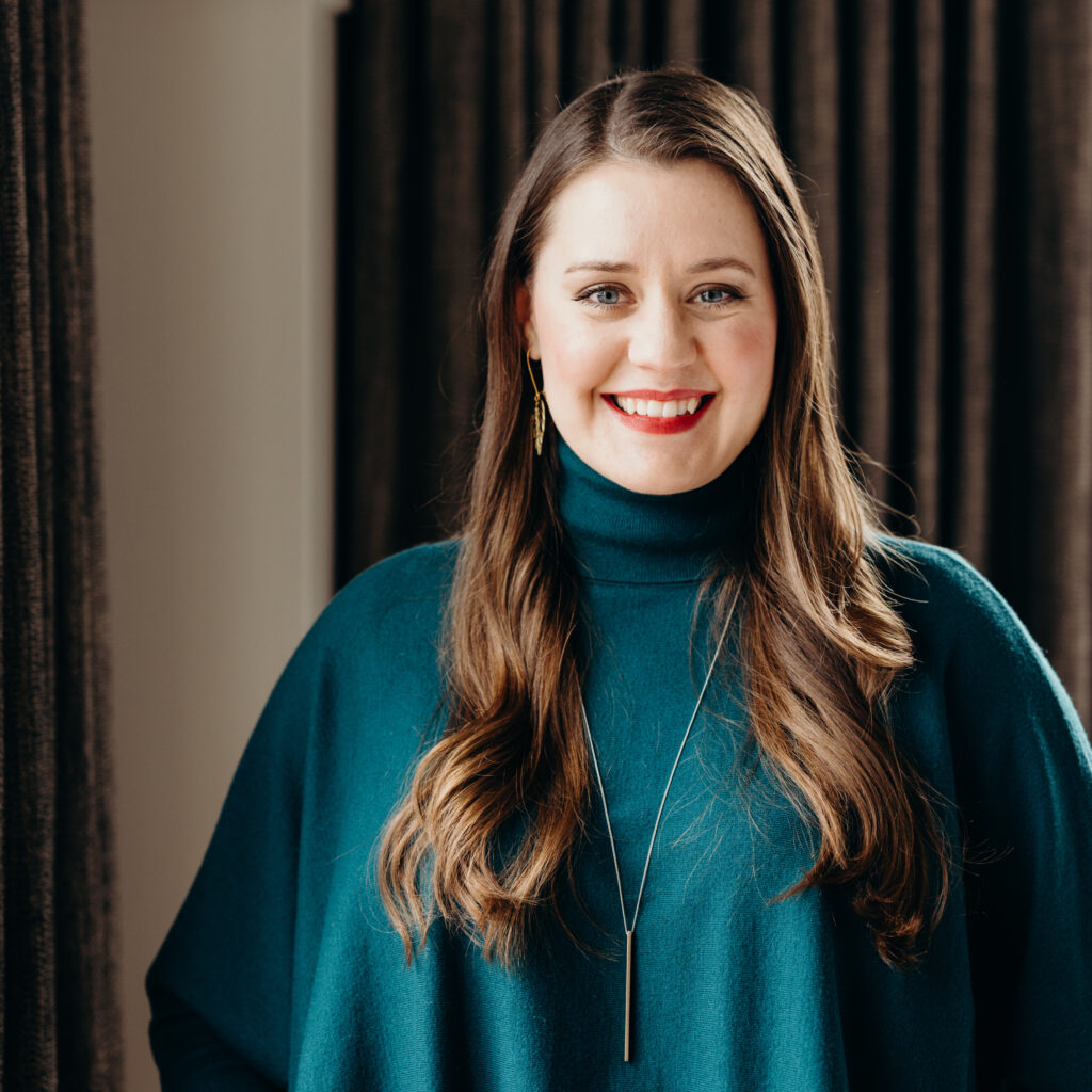 An image of Maegan Megginson is captured. Maegan Megginson is a business coach, group practice owner, and licensed psychotherapist. She is featured on Grow a Group Practice, a therapist podcast.