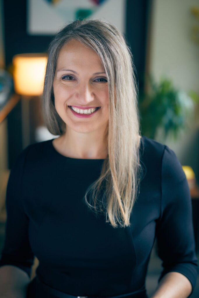 A photo of Finka Jerkovic is captured. She is an author, international speaker, workshop leader, and coach. Finka is featured on Practice of the Practice, a therapist podcast.