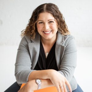 A photo of Kate DiLeo is captured. She is a brand manager and marketing strategist. Kate is featured on Marketing a Practice, a therapist podcast.