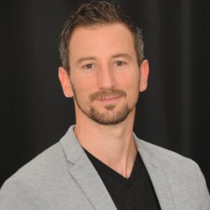 A photo of Adam Lewis Walker is captured. He is a TEDx keynote speaker, coach and best-selling author. Adam is featured on the Practice of the Practice, a therapist podcast.